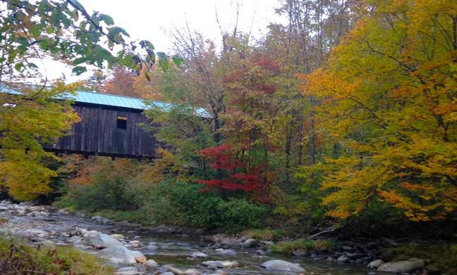 Vermont covered bridge over the Brewster river in fall