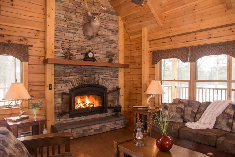 field and stream cabin living area with fireplace | Sterling Ridge Resort