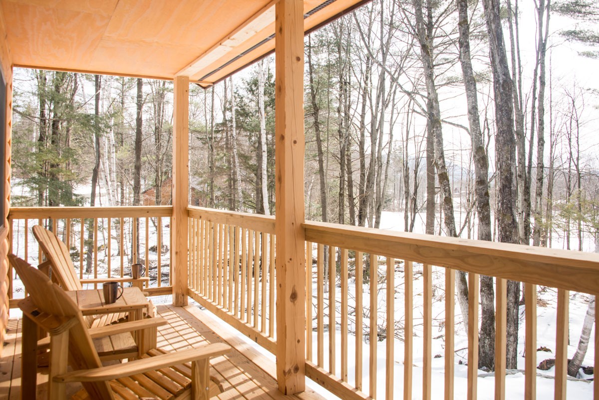 View from a covered porch at a cabin during winter | Sterling Ridge Resort