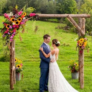 bride and groom under arch at Sterling Ridge Resort