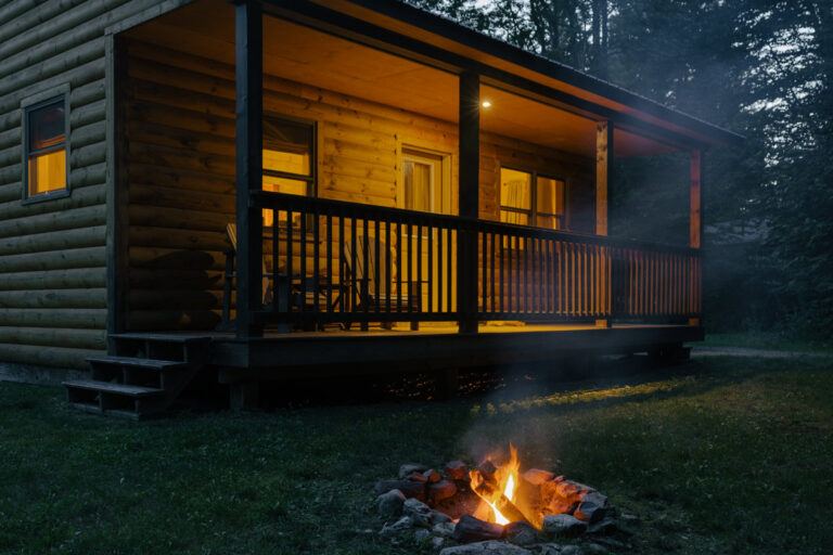 Sterling ridge cabin in the evening with a fire pit
