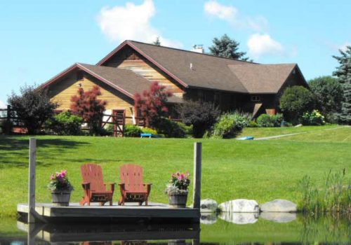 Mansfield House with pond | Sterling Ridge Log Cabin Resort